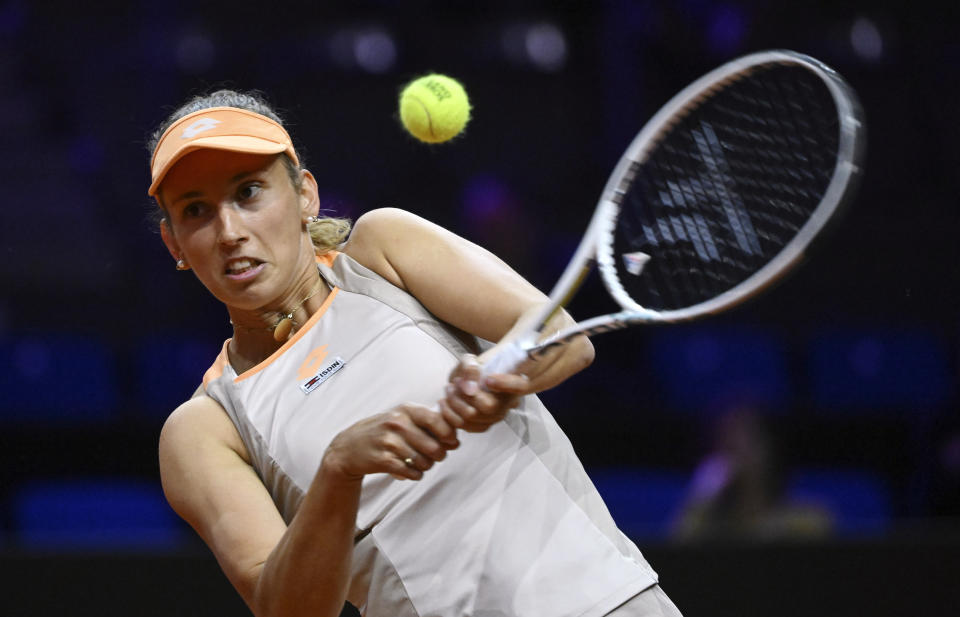 Belgium's Elise Mertens plays a return to Germany's Tatjana Maria during the WTA Tour tennis match in Stuttgart, Germany, Tuesday April 16, 2024. (Marijan Murat/dpa via AP)