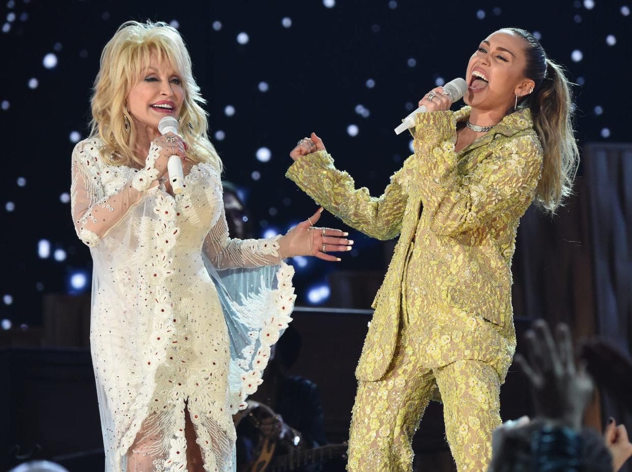 Dolly Parton (L) and Miley Cyrus perform onstage during the 61st Annual GRAMMY Awards at Staples Center on February 10, 2019 in Los Angeles, California.