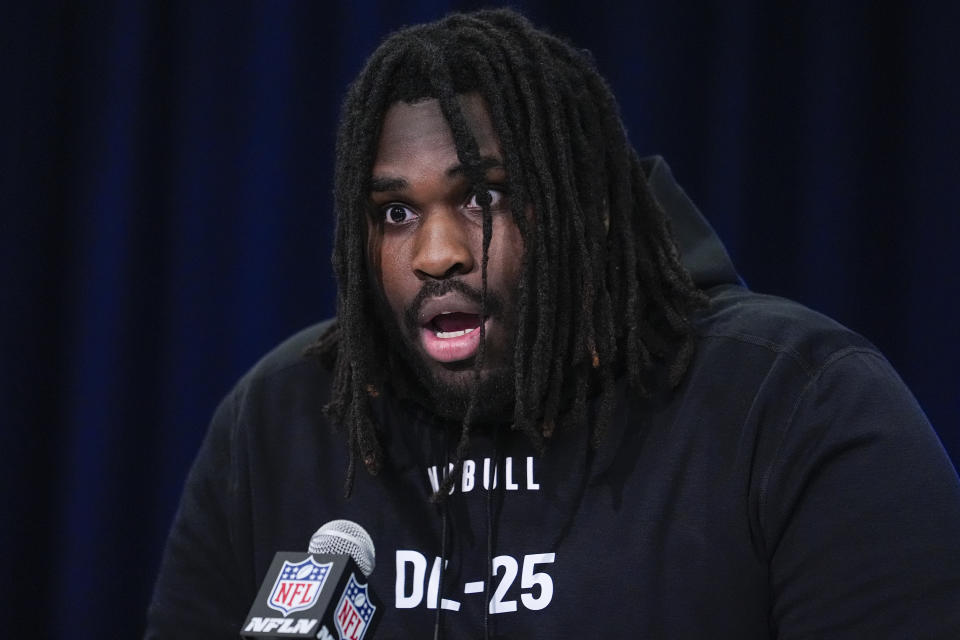 Texas defensive lineman T'Vondre Sweat jokes how people will react after he runs the 40-yard dash as he speaks during a press conference at the NFL football scouting combine in Indianapolis, Wednesday, Feb. 28, 2024. (AP Photo/Michael Conroy)