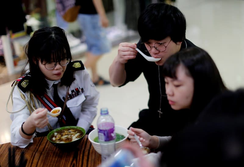 The Wider Image: Sermons with saline: Hong Kong pastor offers aid and prayers