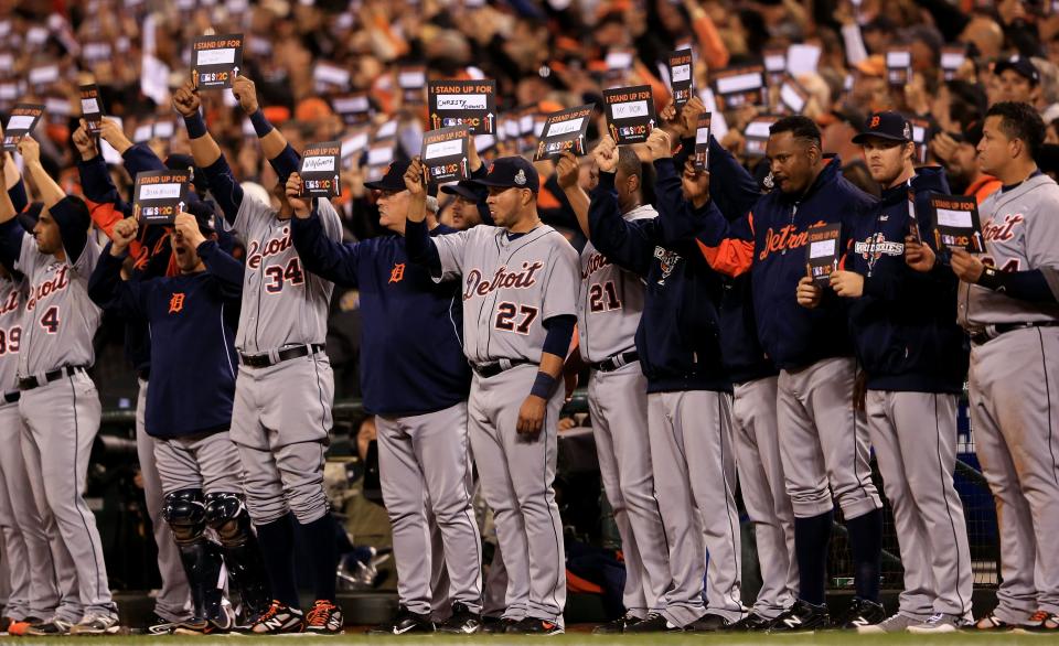 SAN FRANCISCO, CA - OCTOBER 24: Players and fans hold up signs for "Stand Up To Cancer" during Game One between the San Francisco Giants and the Detroit Tigers in the Major League Baseball World Series at AT&T Park on October 24, 2012 in San Francisco, California. (Photo by Doug Pensinger/Getty Images)