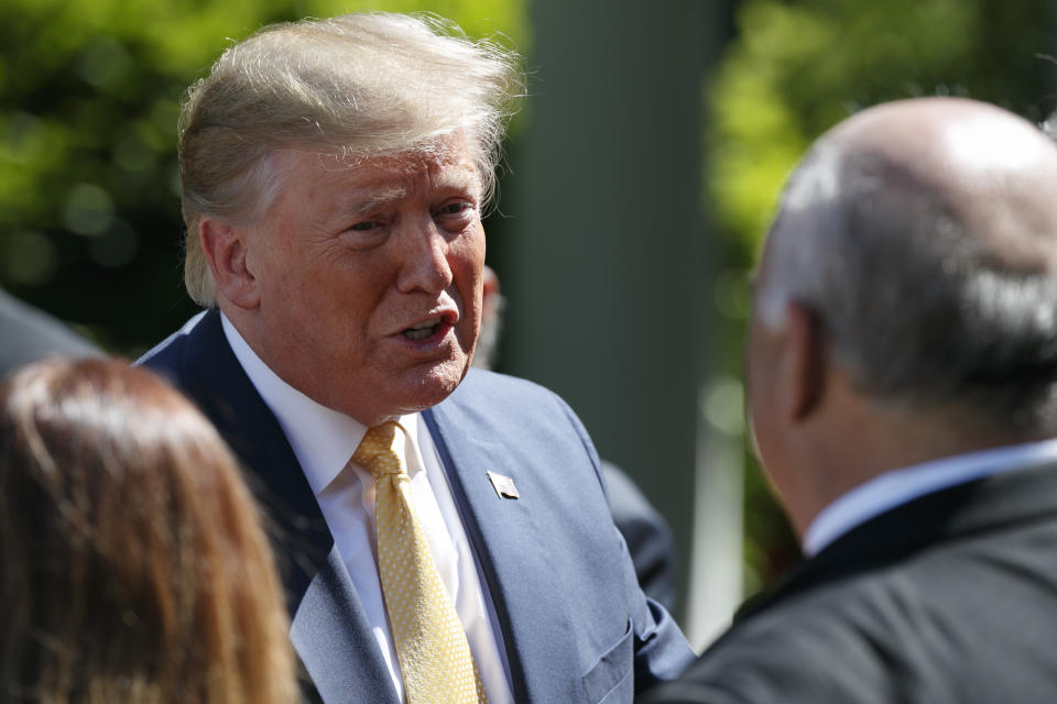 President Donald Trump greets small business owners after speaking in the Rose Garden of the White House, Friday June 14, 2019, in Washington. (AP Photo/Jacquelyn Martin)