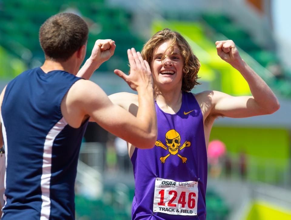 Marshfield's Bodey Lutes, right, celebrates his victory 4A boys 400 meters on the final day of the OSAA state track and field championship at Hayward Field in Eugene Saturday, May 27, 2023. 