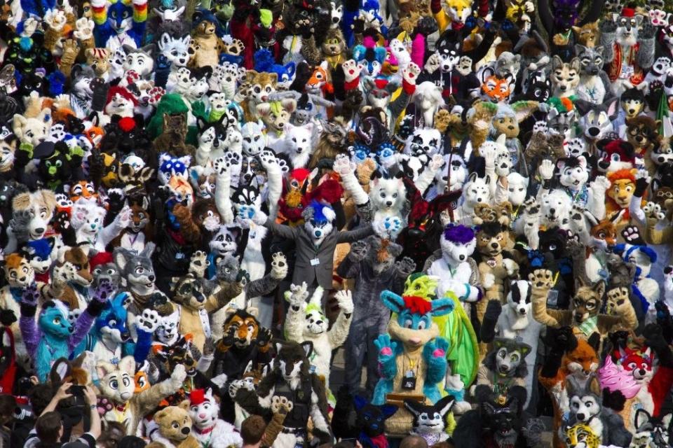 Delegates to the Eurofurence, "Europe's biggest furry convention" pose for a picture in front of the conference hotel in Berlin