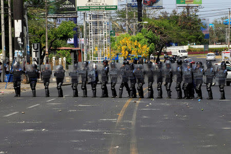 Riot police block a street during a protest against reforms that implement changes to the pension plans of the Nicaraguan Social Security Institute (INSS) in Managua, Nicaragua April 19,2018. REUTERS/Oswaldo Rivas