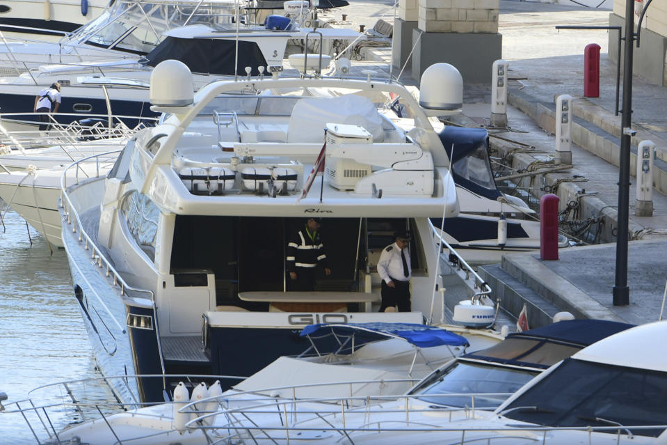 Police aboard the yacht "Gio" after it was intercepted on a course for Sicily by the Maltese military early Wednesday, Nov. 20, 2019, and forced back to Portomaso, Malta. Authorities arrested owner and prominent businessman Yorgen Fenech. No details of the charges have been revealed, but authorities would have 48 hours to decide on them. (AP Photo/Jonathan Borg)
