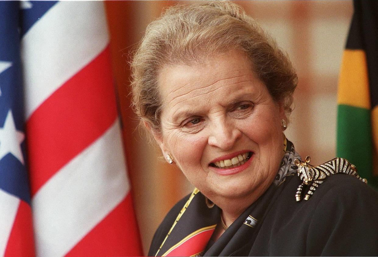 madeleine albright us secretary of state wearing a zebra on her shoulder smiles, december 13 as she listens to south african deputy president thabo mbeki answers questions during their joint pressconference in pretoria albright had talks with thabo mbeki before she sat down with south african president mandela as a part of her african tour afp photo afpodd andersenoa photo by odd andersen afp photo by odd andersenafp via getty images