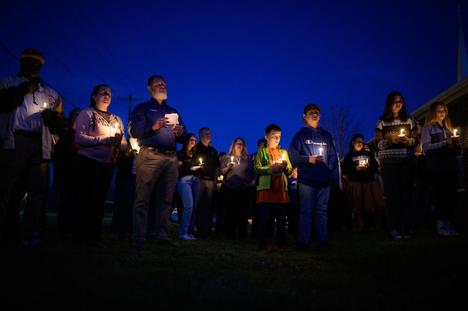 People participate in a candlelight vigil at Grace Bible Church near Tanglewood Middle School Friday, April 1, 2022. Participants prayed for 12-year-old Jamari Jackson, who was fatally shot yesterday by another 12-year-old boy.