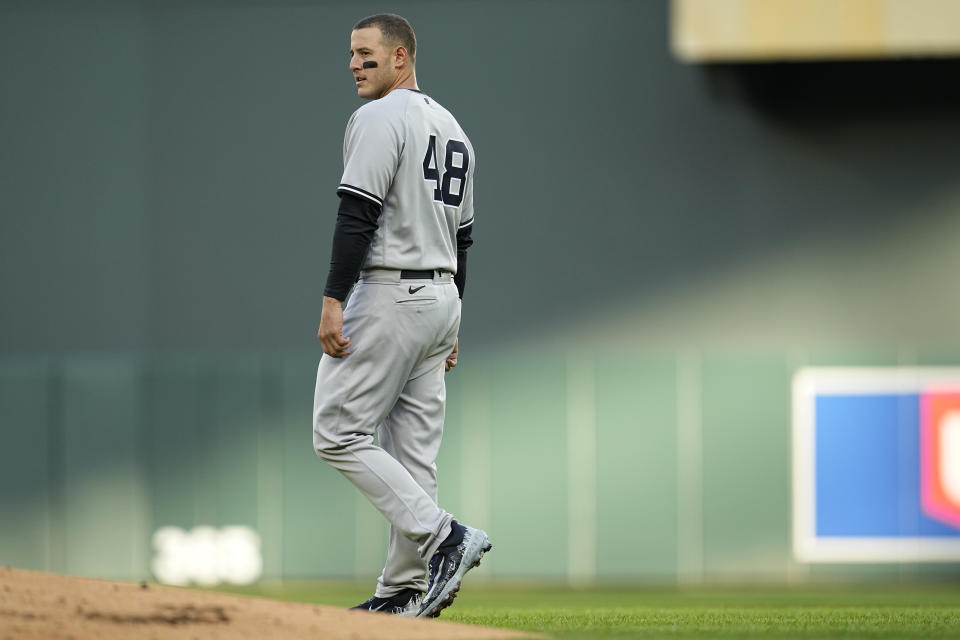 New York Yankees' Anthony Rizzo (48) walks across the field after striking out to end the top of the first inning of a baseball game against the Minnesota Twins, Monday, April 24, 2023, in Minneapolis. (AP Photo/Abbie Parr)