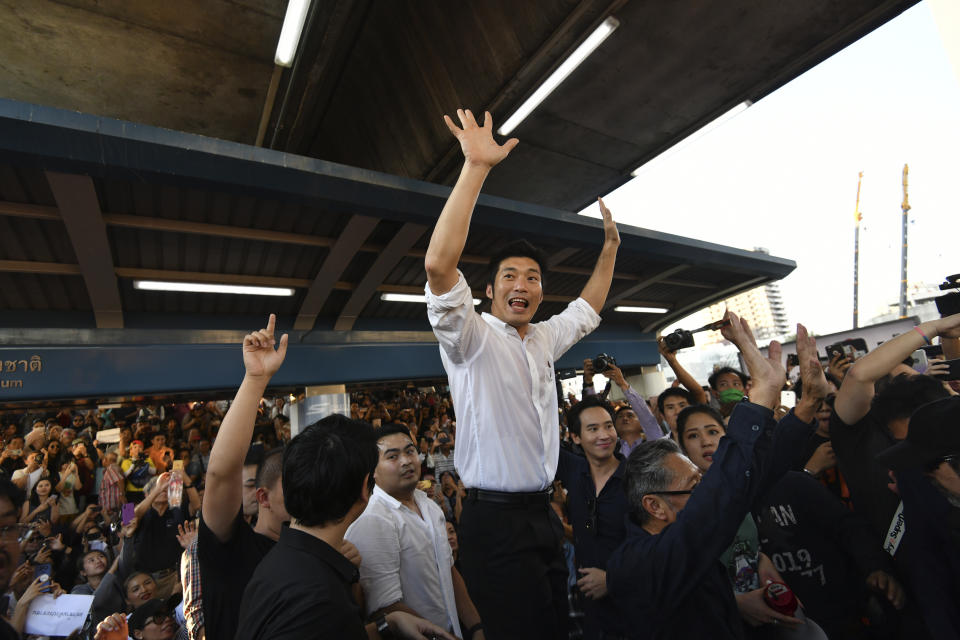 Thailand's Future Forward Party leader Thanathorn Juangroongruangkit talks to his supporters during rally in Bangkok, Thailand, Saturday, Dec. 14, 2019. Several thousand supporters of a popular Thai political party, under threat of dissolution, packed a concourse in central Bangkok on Saturday in one of the largest political demonstrations in recent years. (AP Photo/Str)