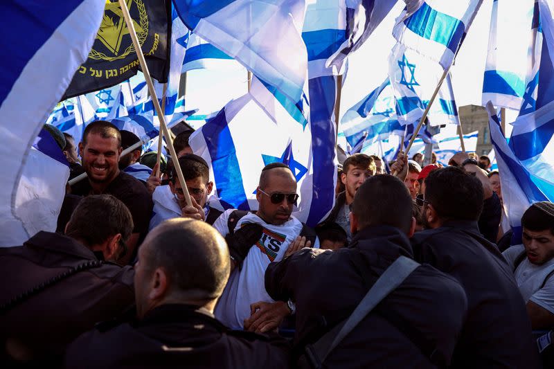 Israeli security forces scuffle with Israeli right wing protestors during a rally in Jerusalem