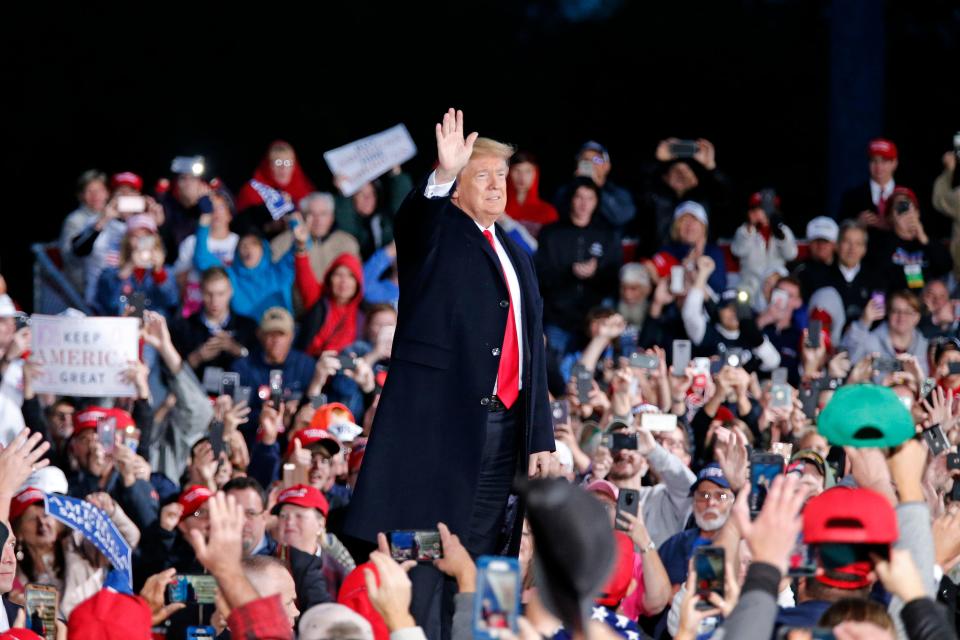 President Donald Trump takes the state as he's introduced during a Make America Great Again rally at the warren County Fair Grounds in Lebanon, Ohio, on  Oct. 12, 2018.