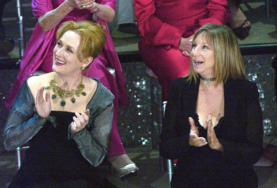 FILE - In this March 23, 2003, file photo, actresses Meryl Streep, left, and Barbra Streisand applaud on stage during a reunion of past Oscar winners during the 75th Academy Awards in Los Angeles. Streisand told MSNBC 