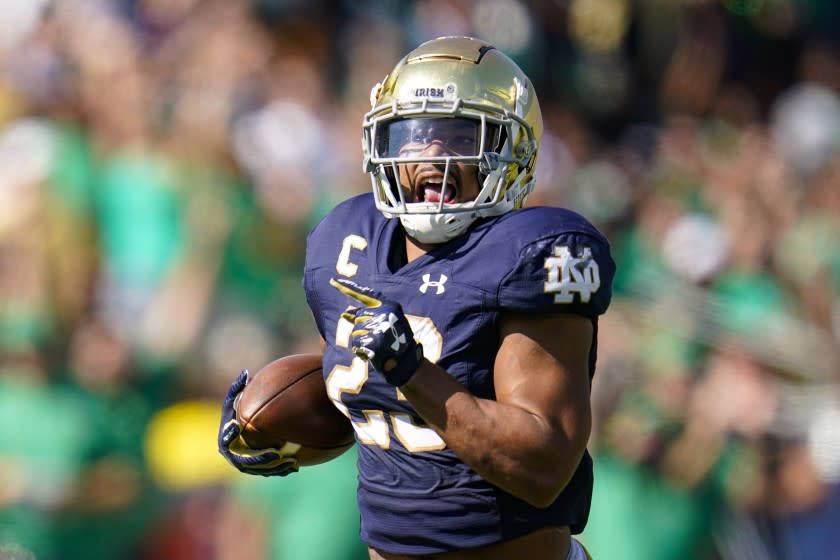 Notre Dame running back Kyren Williams (23) runs in for a touchdown against Purdue during the first half of an NCAA college football game in South Bend, Ind., Saturday, Sept. 18, 2021. (AP Photo/Michael Conroy)