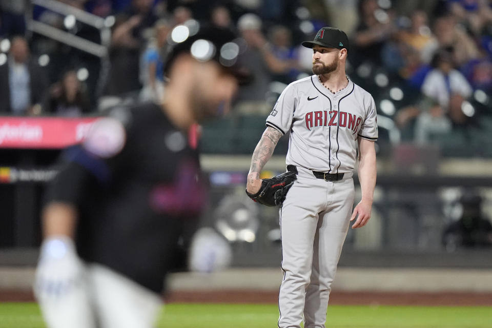 Arizona Diamondbacks pitcher Logan Allen, right, reacts as New York Mets' J.D. Martinez runs the bases after hitting a two-run home run during the sixth inning of a baseball game, Friday, May 31, 2024, in New York. (AP Photo/Frank Franklin II)