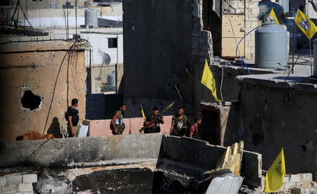 A Palestinian Fatah fighter holds a weapon inside the Ain el-Hilweh refugee camp near Sidon, southern Lebanon, August 23, 2017. REUTERS/Ali Hashisho