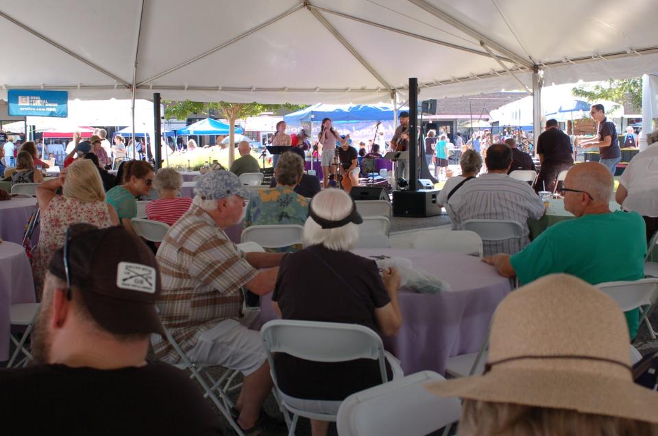 Crowds eat and watch concerts at the 2022 Lavender Festival.