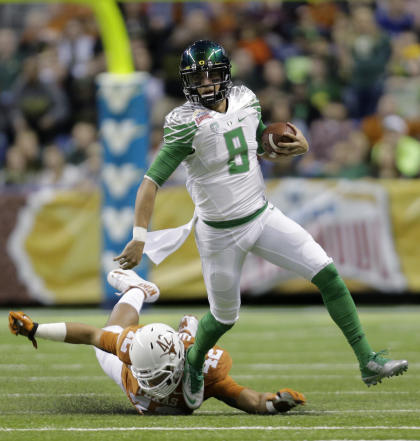 Oregon's Marcus Mariota is a serious Heisman Trophy contender. (AP)