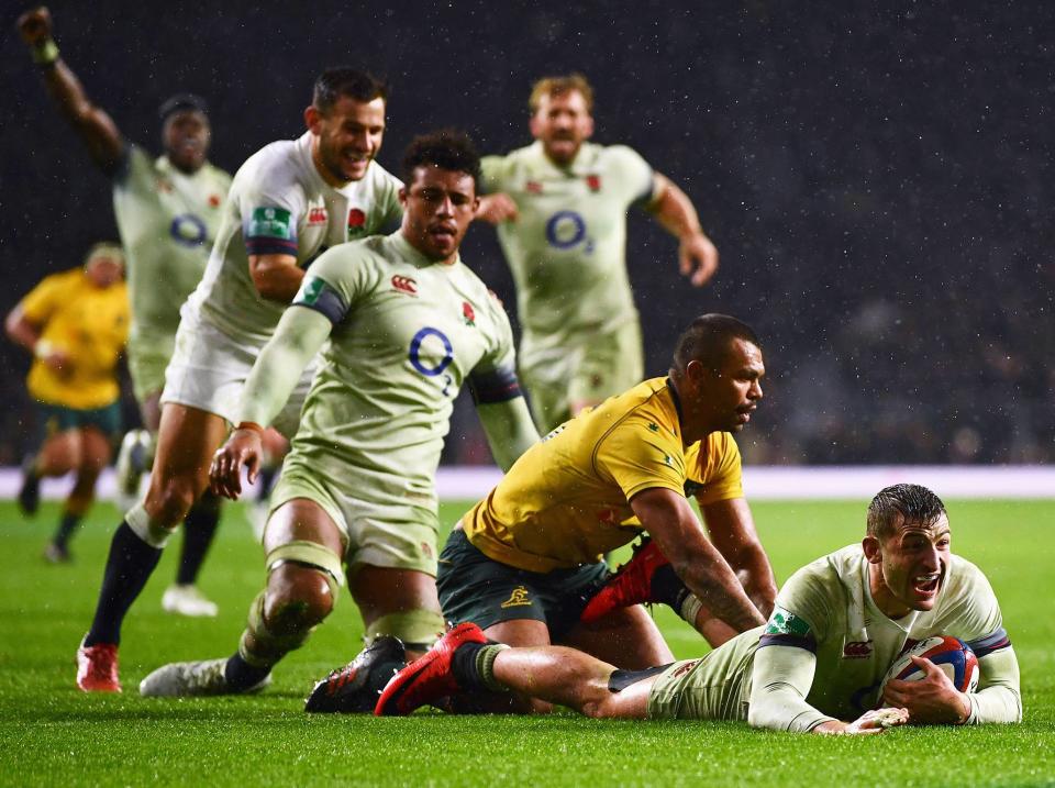 Elliot Daly celebrates his late try: Getty