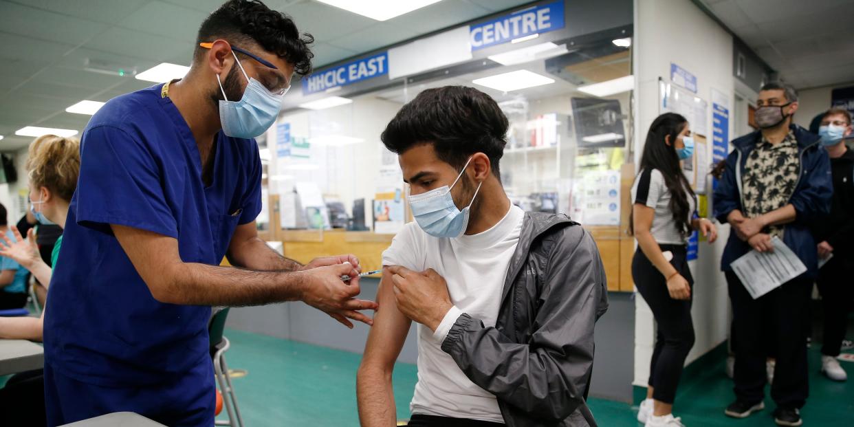 Young man receives vaccine.