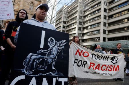 Demonstrators gather outside Sydney's Town Hall to protest against alleged child abuse in Australia's Northern Territory detention centers, July 30, 2016. REUTERS/Jason Reed