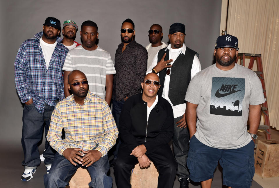 Rappers Ghostface Killah, Method Man, GZA, RZA, Inspectah Deck, Cappadonna, Raekwon, (L-R, seated), Masta Killa and U-God of the Wu-Tang Clan pose at a press conference to announce they have signed with Warner Bros. Records at Warner Bros. Records on October 2, 2014 in Burbank, California.
