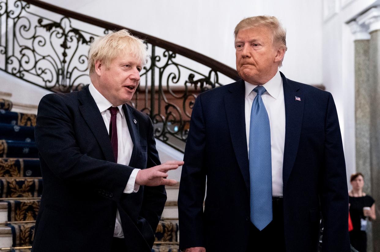 President Donald Trump and Britain's Prime Minister Boris Johnson, left, speak to the media before a working breakfast meeting at the Hotel du Palais on the sidelines of the G-7 summit in Biarritz, France, Sunday, Aug. 25, 2019. (Photo: ASSOCIATED PRESS)