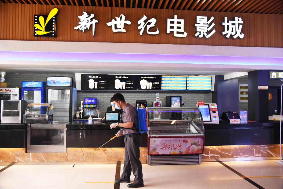 JINAN, July 20, 2020  -- An employee disinfects a movie theater which has reopened in Jinan, east China's Shandong Province, July 20, 2020.   Some movie theaters have reopened on Monday in Jinan on the premise that proper prevention and control measures have been put into place. (Photo by Wang Kai/Xinhua via Getty) (Xinhua/Wang Kai via Getty Images)