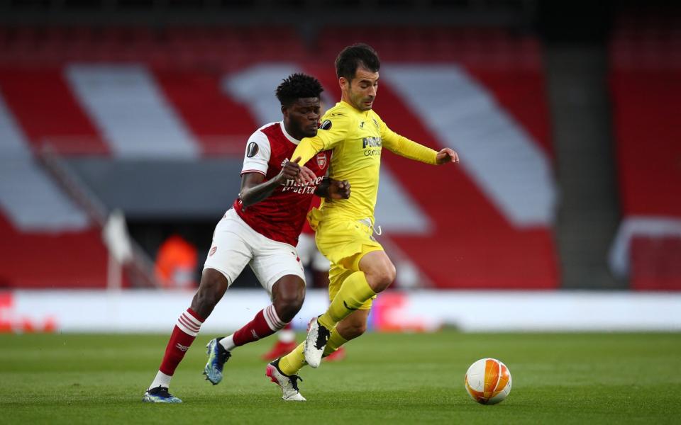 Manu Trigueros of Villarreal CF battles for possession with Thomas Partey of Arsenal - Getty Images