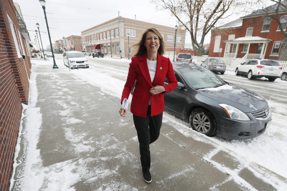 In this Nov. 11, 2019, photo, U.S. Rep. Cindy Axne, D-Iowa, arrives at the American Legion Post 184 to speak to local residents in Winterset, Iowa. Axne defeated a Republican incumbent in 2018 even as she lost 15 of her district's 16 counties. Axne won by offsetting her losses in rural counties with an overwhelming victory in urban Polk County. (AP Photo/Charlie Neibergall)