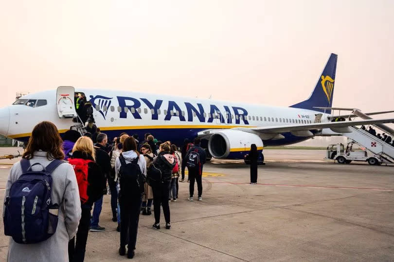 Passengers wait to board an aircraft of low cost Irish airline Ryanair at Treviso's Antonio Canova airport on March 17, 2024. (Photo by John MACDOUGALL / AFP) (Photo by JOHN MACDOUGALL/AFP via Getty Images)