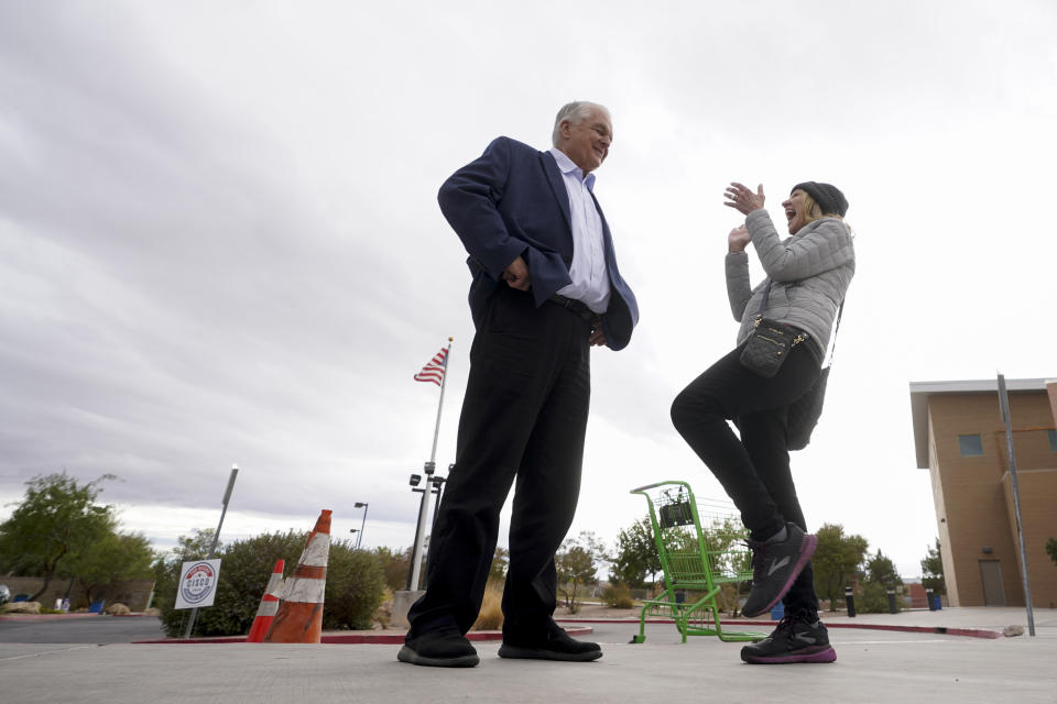 Nevada Gov. Steve Sisolak, left, greets a supporter during a campaign event, Tuesday, Nov. 8, 2022, in Las Vegas. (AP Photo/Gregory Bull)