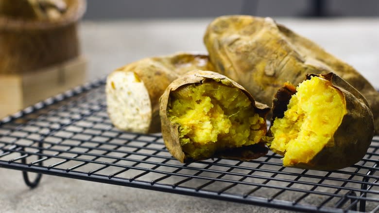 Baked sweet potatoes on cooling rack