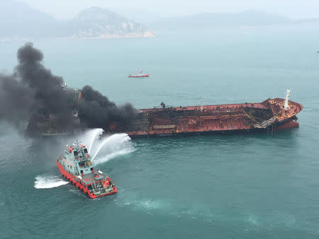 An oil tanker on fire is seen near Lamma island, Hong Kong, China January 8, 2019. Government Flying Service/Handout via REUTERS