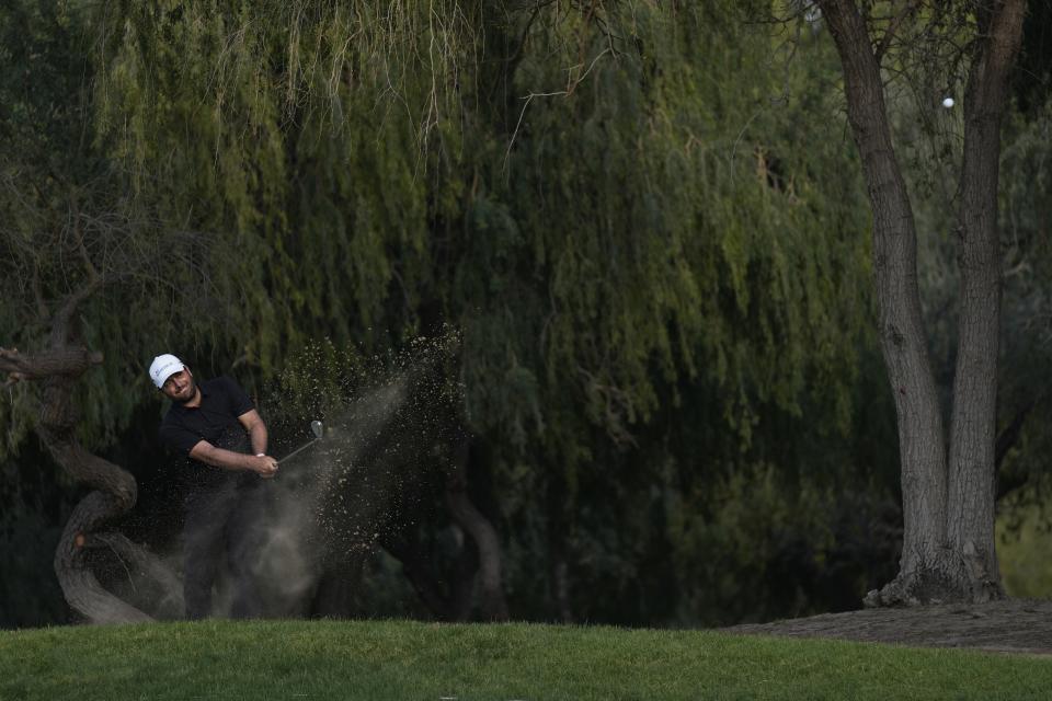 Francesco Molinari of Italy plays his second shot on 13th hole during the first round of the Hero Dubai Desert Classic golf tournament in Dubai, United Arab Emirates, Thursday, Jan. 18, 2024. (AP Photo/Kamran Jebreili)