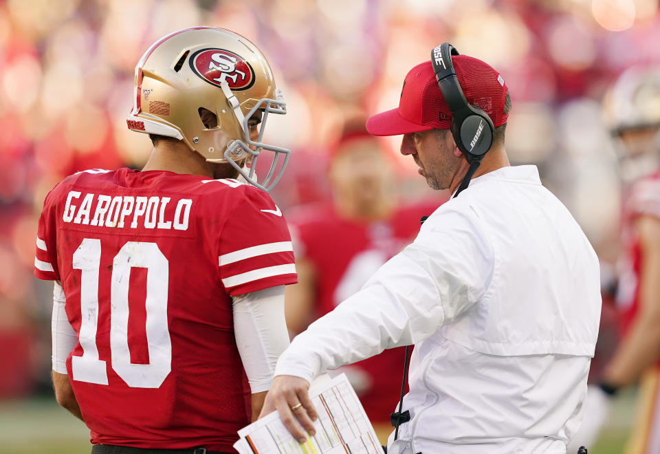 SANTA CLARA, CALIFORNIA - JANUARY 11: Jimmy Garoppolo #10 speaks with head coach Kyle Shanahan of the San Francisco 49ers during the NFC Divisional Round Playoff game against the Minnesota Vikings at Levi's Stadium on January 11, 2020 in Santa Clara, California. (Photo by Thearon W. Henderson/Getty Images)