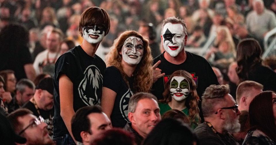 A family wears full makeup to Kiss's 'The End of the Road World Tour' to Gainbridge Fieldhouse on Saturday, Nov. 25, 2023, in Indianapolis.