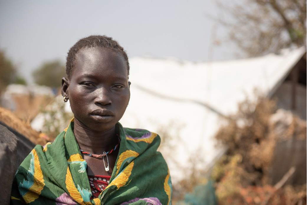 <p>Mary* is a 22-year-old mother-of-four who lives in Pibor</p> (Plan International)