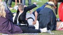 <p>Wrestling on the grass.</p>