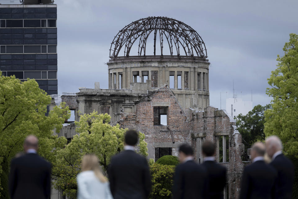 Leaders of the Group of Seven nations' meetings walk before the Atomic Bomb Dome during a visit to the Peace Memorial Park as part of the G7 Leaders' Summit in Hiroshima, western Japan Friday, May 19, 2023. (Brendan Smialowski/Pool Photo via AP)