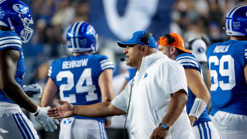 BYU coach Kalani Sitake celebrates with players after a touchdown during a game against Sam Houston at LaVell Edwards Stadium in Provo on Sept. 2, 2023. The Cougars started the year off with a victory over the Bearkats, but endured an uneven season that concluded with five straight losses.