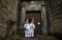 Revellers, dressed as "Zarramache", pose outside the local church during celebrations to mark Saint Blaise's festivity in Casavieja, Spain February 3, 2017. REUTERS/Sergio Perez