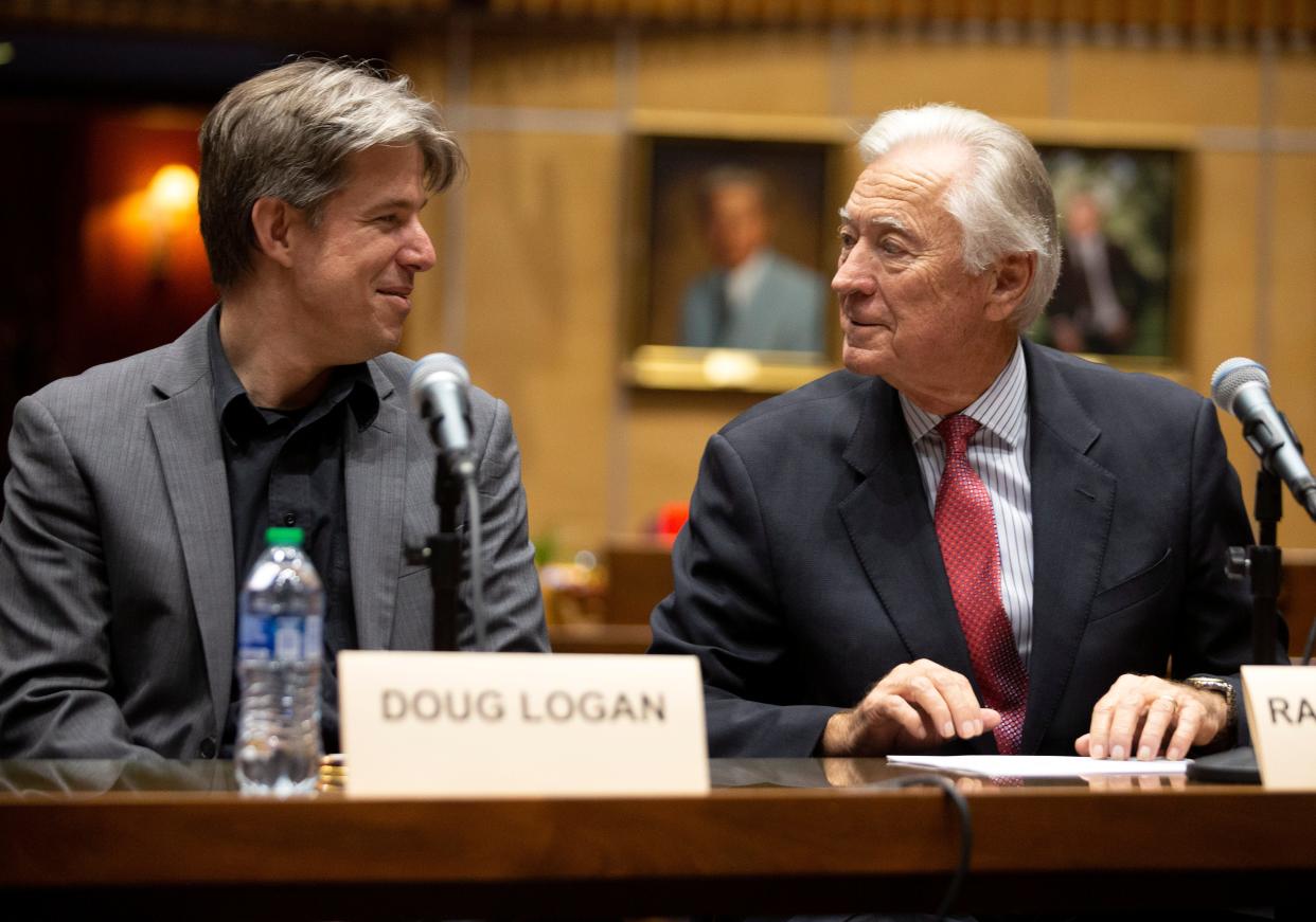 Doug Logan (left), CEO of Cyber Ninjas, and Randy Pullen, audit spokesman, look on before the start of the presentation of the results of the 2020 election audit in Maricopa County to the Arizona lawmakers in the Senate chambers of the Arizona Capitol in Phoenix on Sept. 24, 2021.