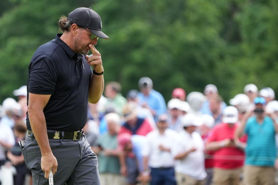 Phil Mickelson, reacting after a putt on the eighth green during the first round of last week's U.S. Open, has been banned by the PGA Tour for defecting to the LIV Tour.