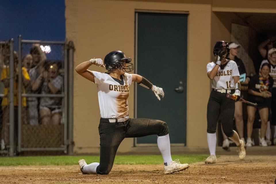 Orioles senior Amanda Lauth celebrates her sliding play at home against the Brownsburg Bulldogs on Wednesday, May 24, 2023, in Indianapolis.