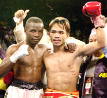 Pacquiao celebrates his victory over Lehlo Ledwaba of South Africa