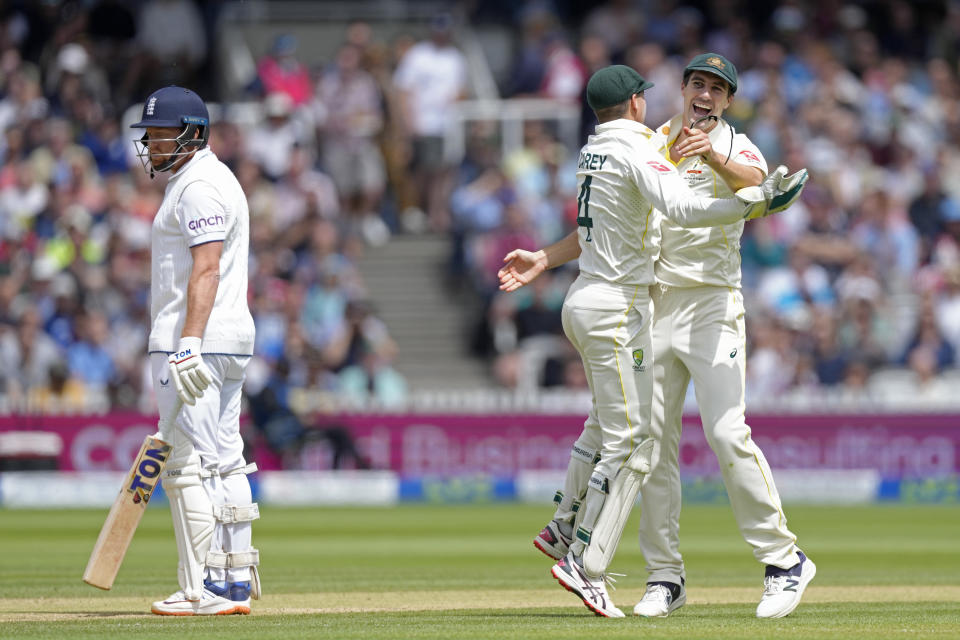 Australia's captain Pat Cummins, right, celebrates with teammate Alex Carey after the dismissal of England's Jonny Bairstow, left, during the fifth day of the second Ashes Test match between England and Australia, at Lord's cricket ground in London, Sunday, July 2, 2023. (AP Photo/Kirsty Wigglesworth)