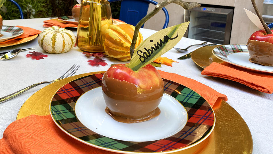 Sabrina Soto's caramel apple place holders put a yummy spin on traditional table decor. (Photo: Yahoo Life)