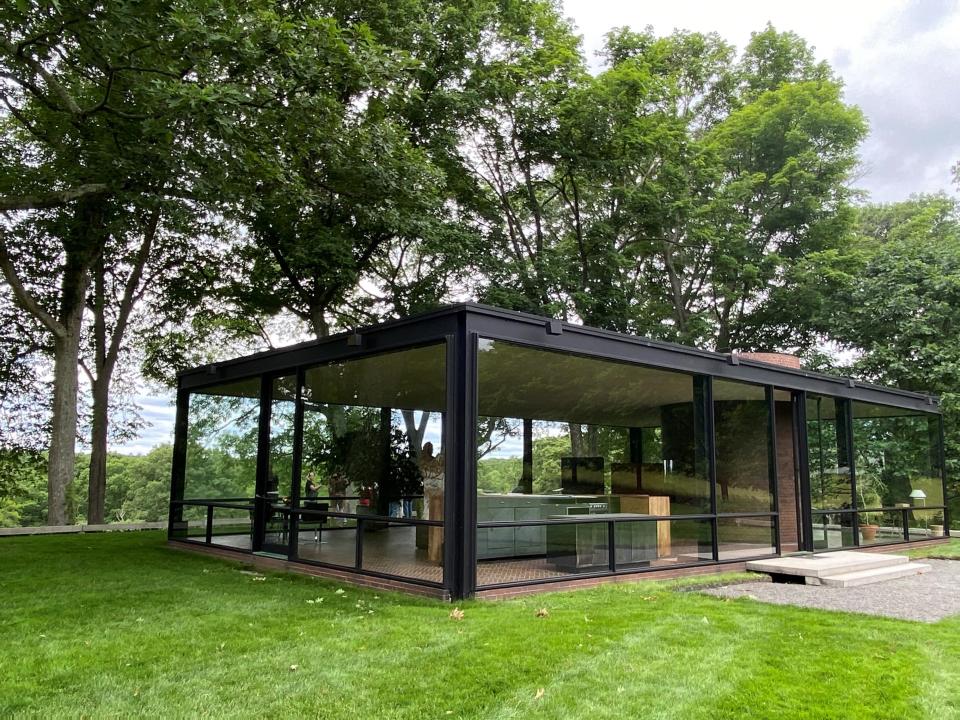 The Glass House, a modern architectural landmark in New Canaan, Conn., was designed by famed architect Philip Johnson. The structure has glass exterior walls and no interior walls, creating a seamless integration into the verdant landscape. The National Trust for Historic Preservation owns and operates the Glass House.