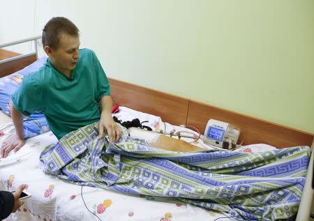 A man, who according to Ukraine's state security service (SBU) is named Alexander Alexandrov and is one of two Russian servicemen recently detained by Ukrainian forces, speaks during an interview with Reuters at a hospital in Kiev, Ukraine, May 28, 2015. REUTERS/Valentyn Ogirenko